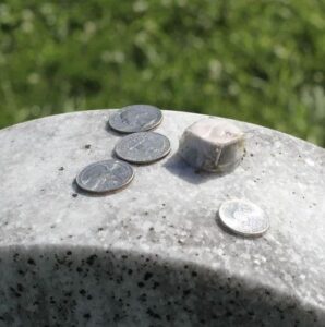 Read more about the article What Does It Mean to Find a Coin on a Loved One’s Gravestone?
