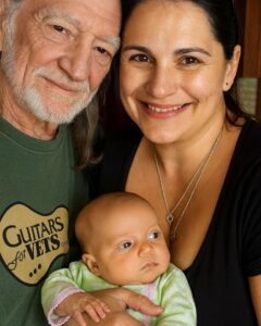 Read more about the article **Willie Nelson: Music as the Thread That Binds Family and Legacy**  “Family has always been my foundation,” Willie Nelson once shared, offering a glimpse into the heart of the man behind the music. To fans, he’s the country music legend whose songs have spanned decades, but to his family, he’s a gentle, devoted grandfather whose love transcends even his iconic career. This connection to family is felt not just in his personal life but in the very music he creates, a warmth that weaves through every note he plays and every lyric he sings.  ### Music That Connects Generations  Willie’s music is more than just melodies and words—it is the essence of his life, filled with love, loyalty, and the shared experiences of family. His album *To All the Girls…* is a tribute to the women who shaped him, including his mother, his daughters, and grandmothers. The album features heartfelt songs, including his poignant rendition of “Grandma’s Hands,” which isn’t just a cover but a personal tribute to the strength and endurance of the women in his life. In his version, Willie captures the spirit of his own family—those timeless bonds that tie us across generations.  Willie’s philosophy of music is clear: *“Music is the thread that keeps my heart connected.”* This thread isn’t just about connecting with audiences, but also about staying grounded in the love and wisdom passed down from his family. When he sings, it’s not just about performing—it’s about carrying his family’s story forward, one song at a time.  ### The Essence of Willie Nelson’s Music  The authenticity that comes through in Willie’s music makes his work stand out. His voice, weathered and timeless, is filled with memories of family reunions, quiet dinners, and the lessons passed down through generations. Each song becomes a reflection of his personal history, as well as a shared experience for anyone who’s ever felt the strength of family love.  What makes Willie’s music so powerful is the way it invites listeners to connect with their own stories. His songs aren’t just his—they are universal. They speak to anyone who has ever known the grounding presence of family, whether it’s through the love of a grandparent or the support of a life partner. In a world that often moves too fast, Willie’s music is a reminder of the enduring truths of love and loyalty.  ### A Legacy Built on Family and Music  Willie Nelson’s career is legendary, but it is his connection to family that truly shines through his music. His songs, especially those that celebrate his loved ones, invite listeners to reflect on their own bonds and roots. He’s built a legacy that doesn’t just focus on fame or accolades but on the quieter, more personal moments of love and devotion that have shaped his life.  Every song is a conversation with his listeners, a way of bringing them into his circle and allowing them to feel a part of his journey. Whether it’s through collaborations with other artists or a solo performance, Willie’s music always reflects authenticity and warmth. His family is at the heart of everything, and when you listen to his songs, you can hear the love, the memories, and the truth of his story.  ### A Living Thread of Memory and Love  For Willie Nelson, music is a living thread—one that weaves together generations, memories, and deep love. It is his way of keeping those bonds alive and sharing them with the world. When you listen to his music, you’re not just hearing a song; you’re hearing a lifetime, filled with moments of tenderness, laughter, and love.  In a world that can sometimes feel disconnected, Willie Nelson’s music reminds us of the importance of family and the ties that bind us all. Whether through a gentle melody or a powerful story, he continues to share a message of love, resilience, and the beauty of the connections we hold dear.